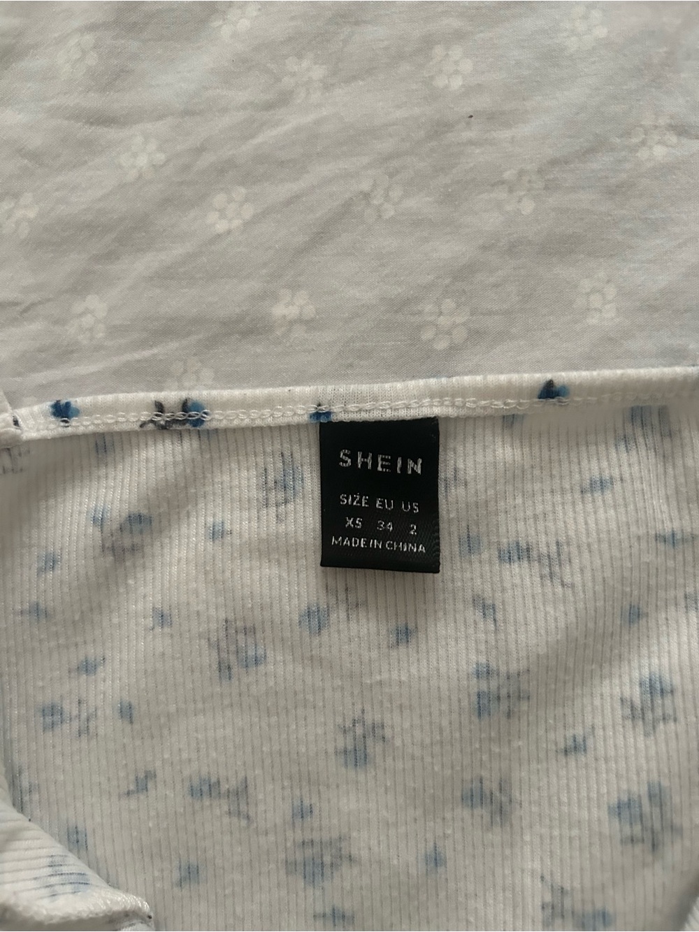 2/$10 White Floral Ribbed Tank Top with Blue Print - Picture 6 of 6